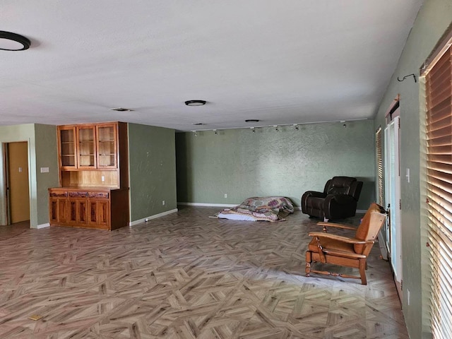 living room with light parquet floors and a healthy amount of sunlight