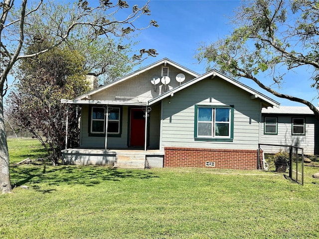 bungalow-style house featuring a front yard