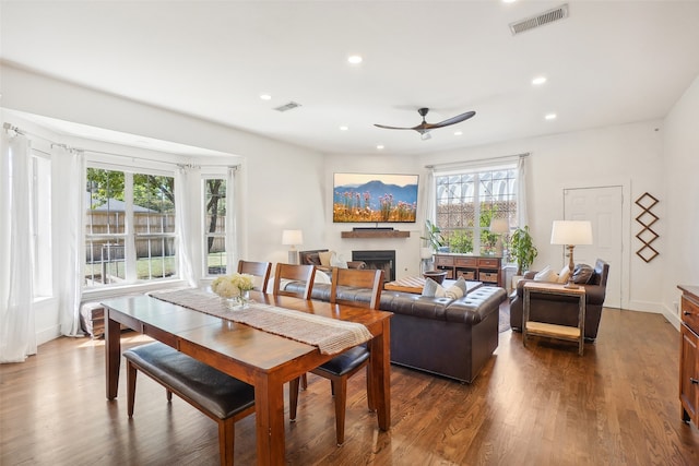 dining area featuring ceiling fan and dark hardwood / wood-style floors