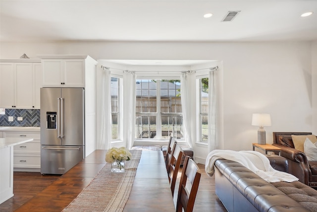 dining area featuring dark wood-type flooring