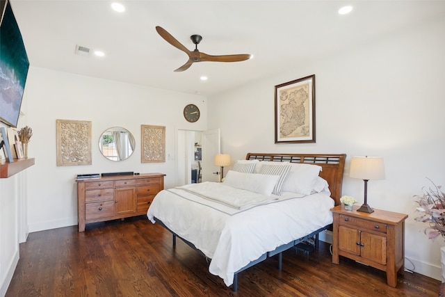 bedroom with ceiling fan and dark wood-type flooring