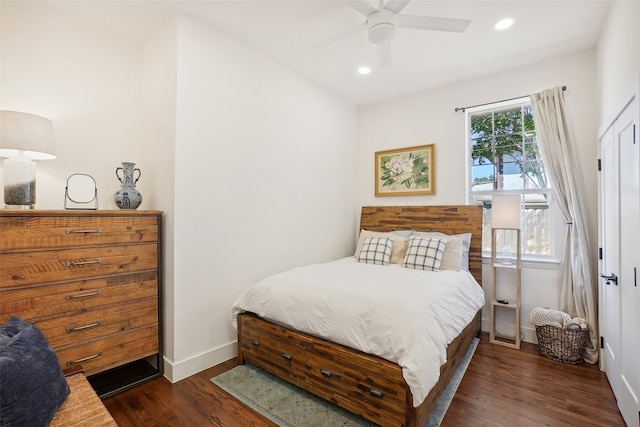 bedroom with ceiling fan and dark wood-type flooring