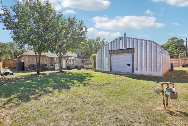 view of yard with a garage and an outdoor structure