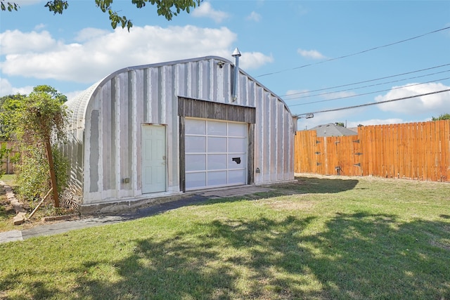 garage featuring a lawn