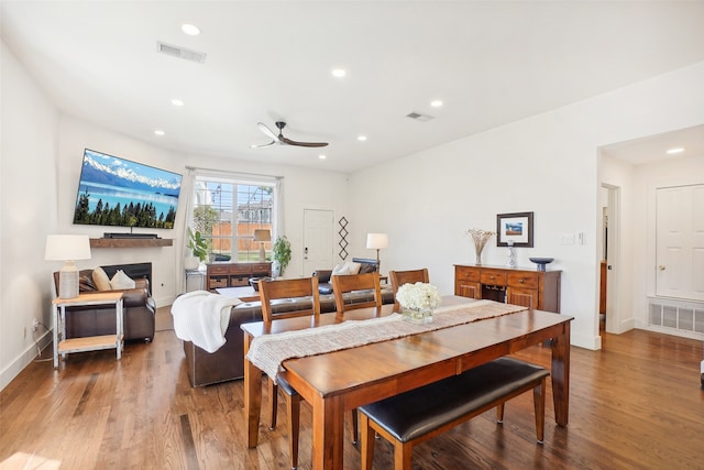 dining area featuring ceiling fan and hardwood / wood-style flooring