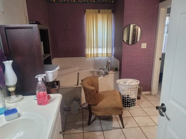 bathroom featuring sink, tile patterned floors, and a bathtub