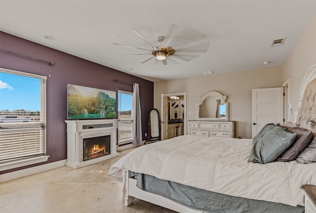 bedroom with multiple windows and ceiling fan