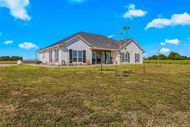 rear view of house with a lawn