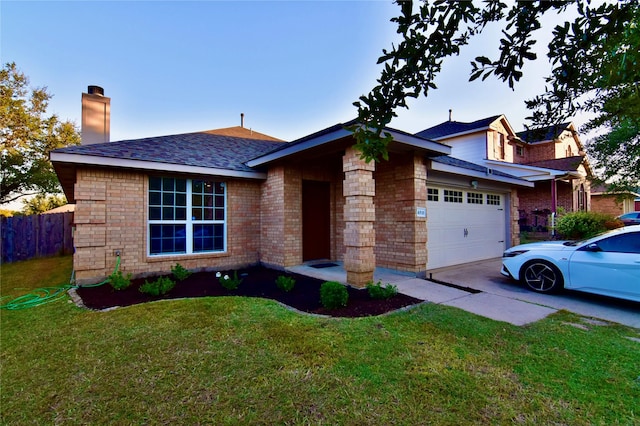 ranch-style home featuring a garage and a front lawn