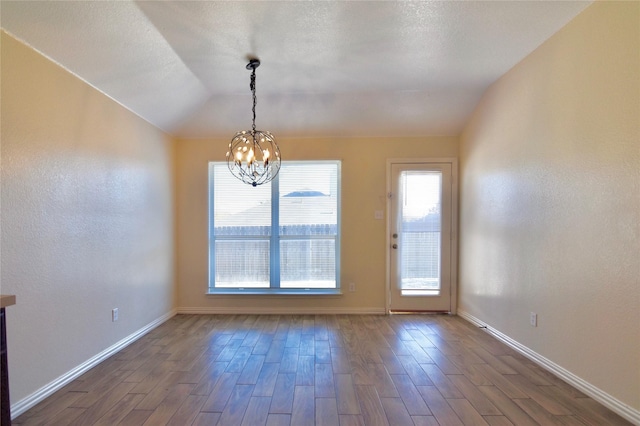 interior space with an inviting chandelier and vaulted ceiling