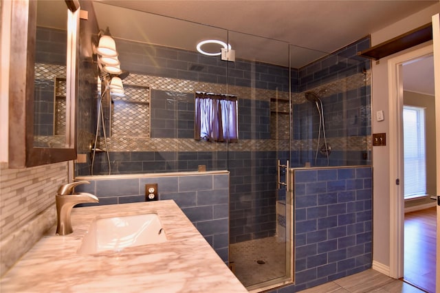 bathroom with vanity and an enclosed shower