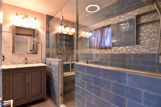 bathroom with vanity and walk in shower