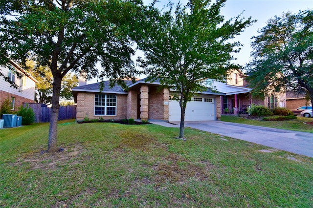 single story home with a garage and a front yard