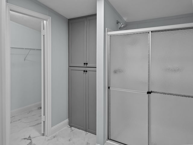 bathroom with a shower with shower door