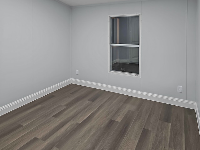 empty room with dark hardwood / wood-style floors