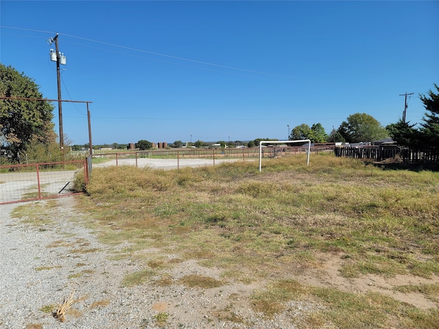 view of yard with a rural view