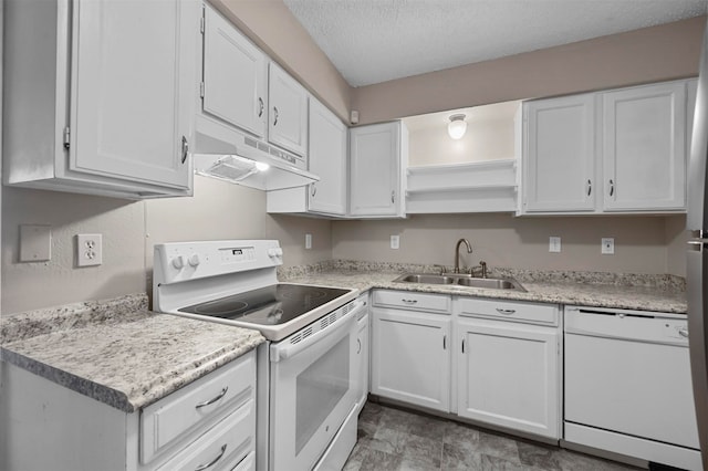 kitchen featuring white appliances, a textured ceiling, sink, and white cabinets