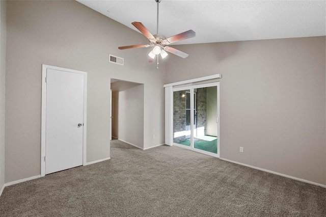 spare room with ceiling fan, high vaulted ceiling, and carpet floors