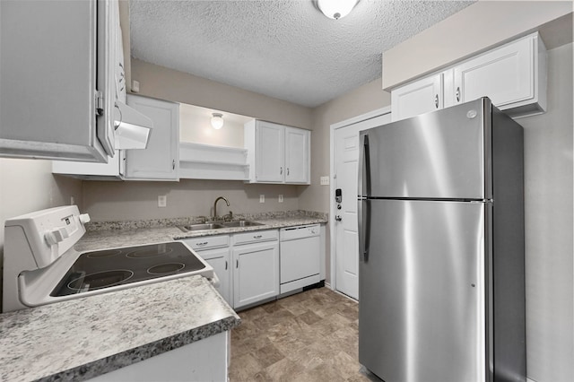 kitchen with premium range hood, white cabinets, sink, and white appliances