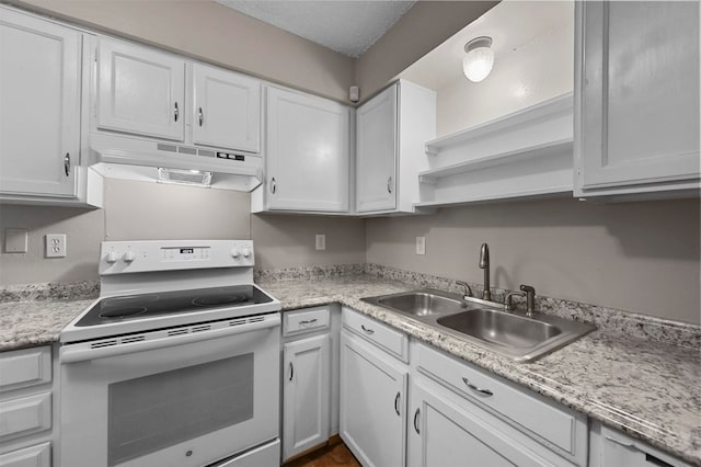 kitchen with sink, exhaust hood, electric range, and white cabinets