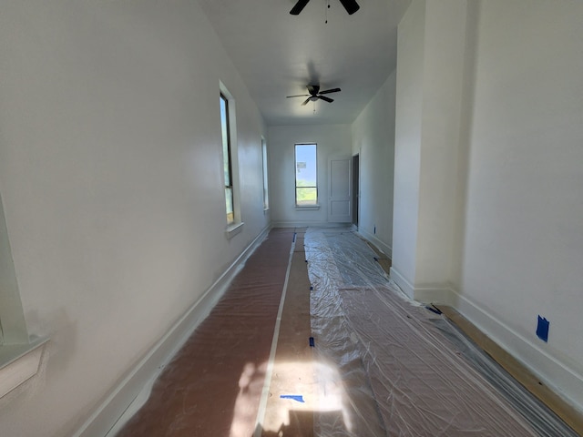 hall with hardwood / wood-style floors