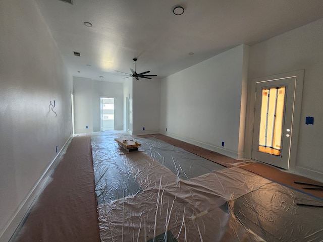 interior space featuring ceiling fan