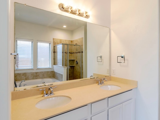 bathroom featuring vanity and plus walk in shower