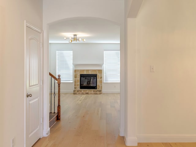 corridor with light hardwood / wood-style floors