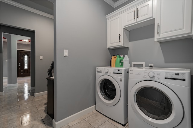 laundry area with light tile patterned floors, crown molding, separate washer and dryer, and cabinets