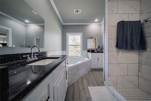 bathroom featuring vanity, crown molding, hardwood / wood-style floors, and independent shower and bath