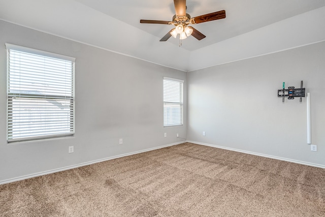 carpeted empty room featuring ceiling fan