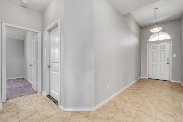 foyer with light carpet