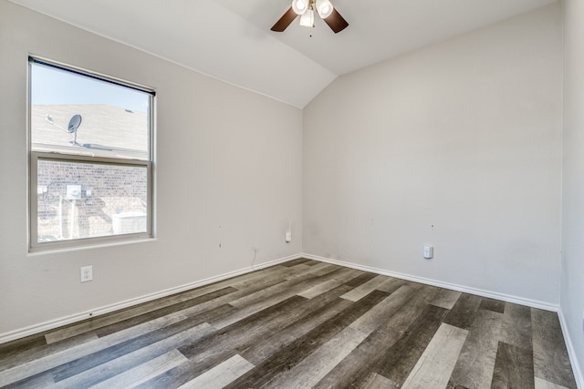 spare room featuring ceiling fan, vaulted ceiling, and dark hardwood / wood-style floors