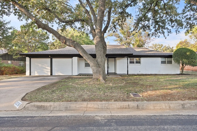 ranch-style house featuring a garage