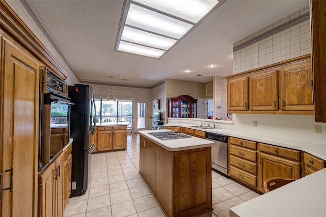 kitchen with kitchen peninsula, crown molding, black appliances, light tile patterned floors, and a center island