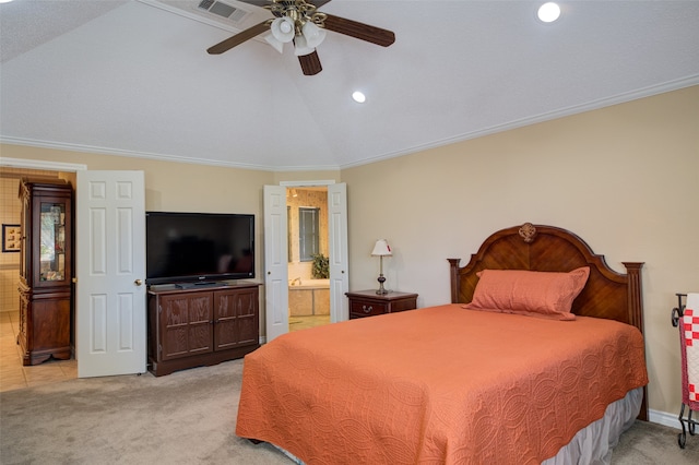 bedroom with ceiling fan, lofted ceiling, ornamental molding, and ensuite bath