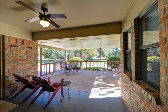 view of patio / terrace with ceiling fan and a porch