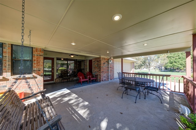 view of patio / terrace featuring a garage