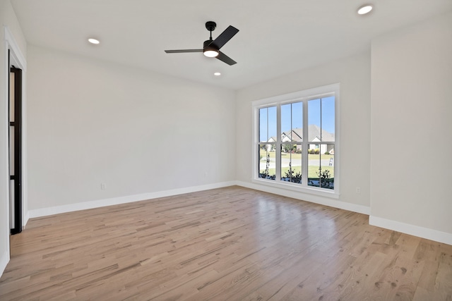 unfurnished room featuring light wood-type flooring and ceiling fan