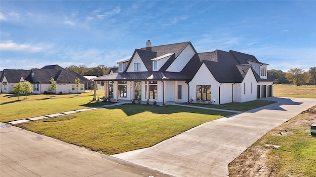 view of front of home featuring a front yard and covered porch