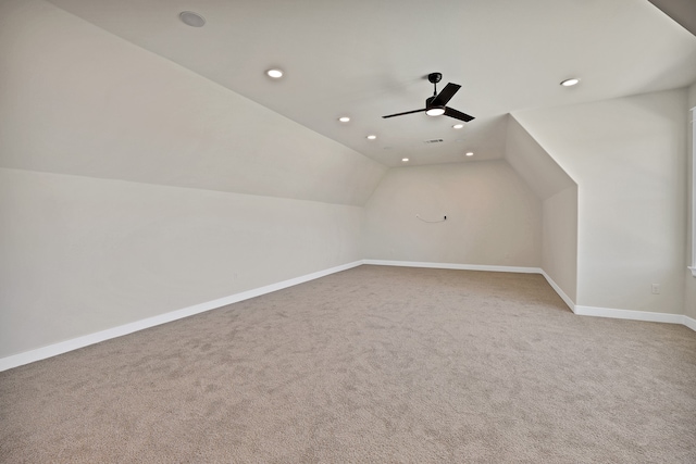 bonus room with carpet floors, ceiling fan, and vaulted ceiling