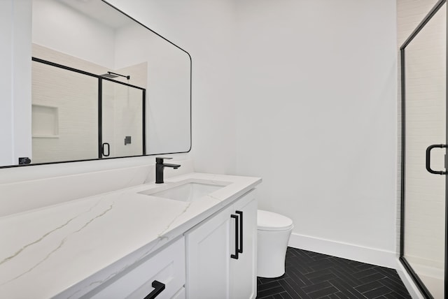 bathroom featuring vanity, walk in shower, toilet, and tile patterned flooring