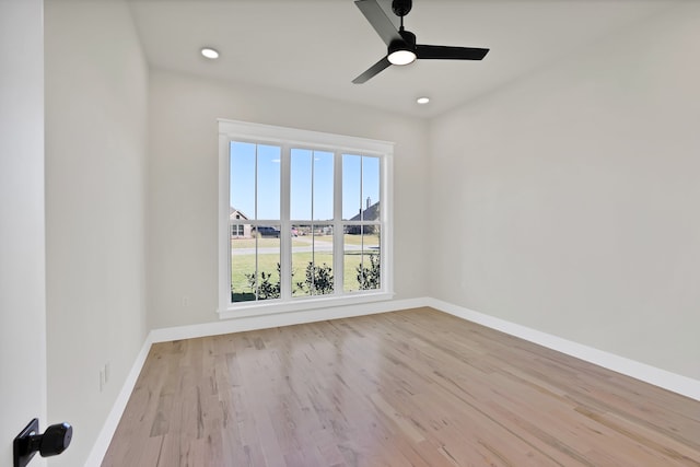 unfurnished room with light wood-type flooring and ceiling fan