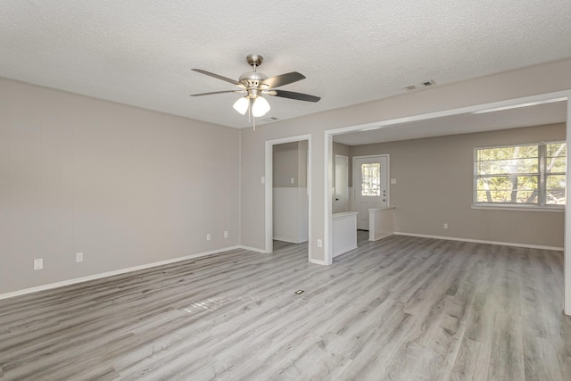 509 Ridgeview Dr, Rockwall, TX 75087 - spare room with a ceiling fan, light wood finished floors, a textured ceiling, and baseboards