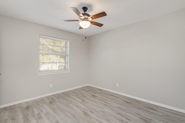 509 Ridgeview Dr, Rockwall, TX 75087 - spare room with wood finished floors, a ceiling fan, baseboards, and a textured ceiling