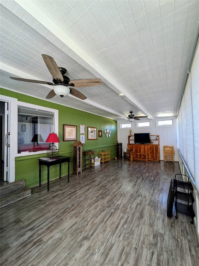 misc room with hardwood / wood-style flooring, ceiling fan, and beam ceiling