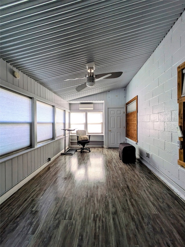 interior space featuring an AC wall unit and ceiling fan