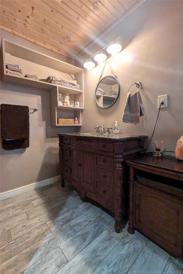 bathroom with vanity, wood-type flooring, and wood ceiling