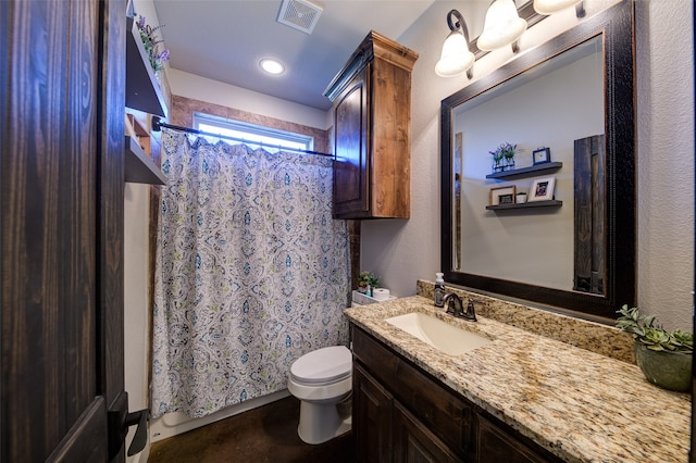 bathroom with a shower with curtain, vanity, and toilet