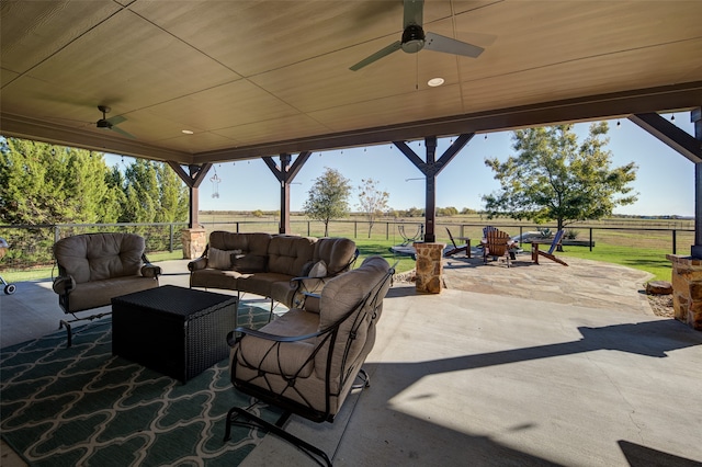 view of patio / terrace featuring ceiling fan, a rural view, and an outdoor hangout area